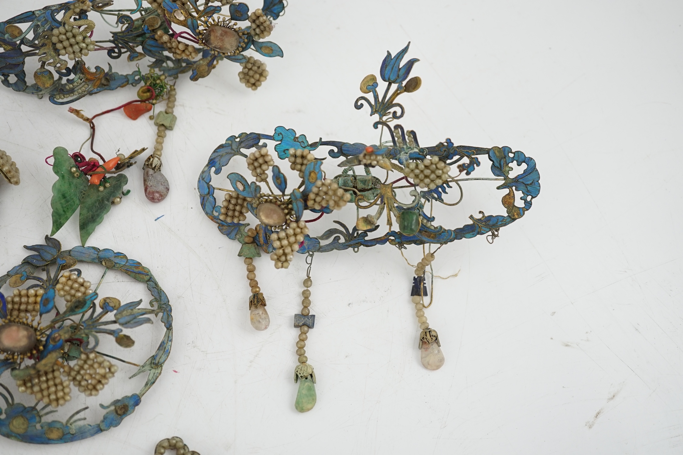 A group of eight Chinese kingfisher feather, jade, seed pearl, coral and hardstone mounted headdresses and ornaments, late Qing dynasty, some losses